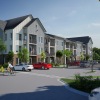 a multistory building with cars in front of it