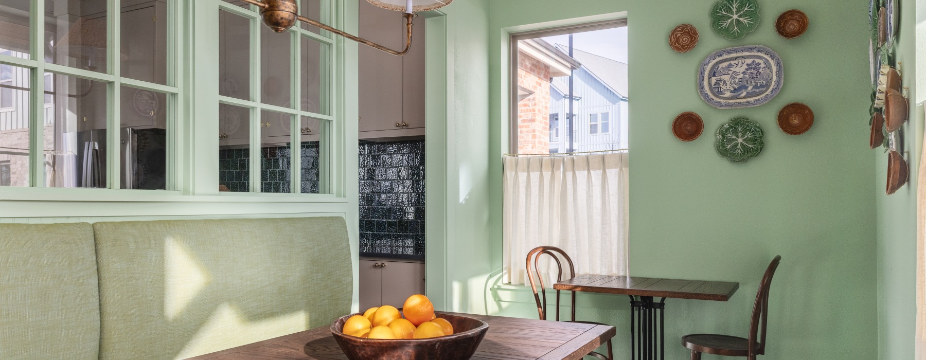 A dining space with oranges on the table